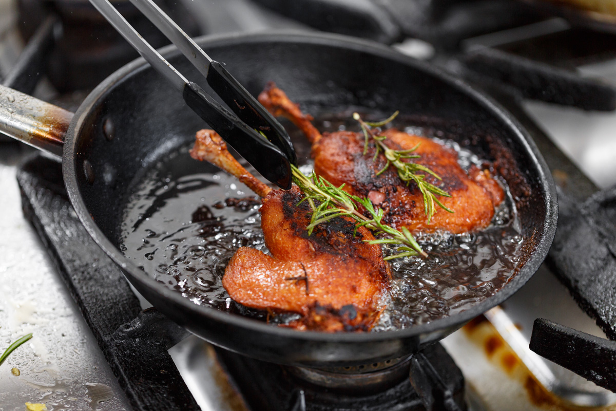 duck legs frying