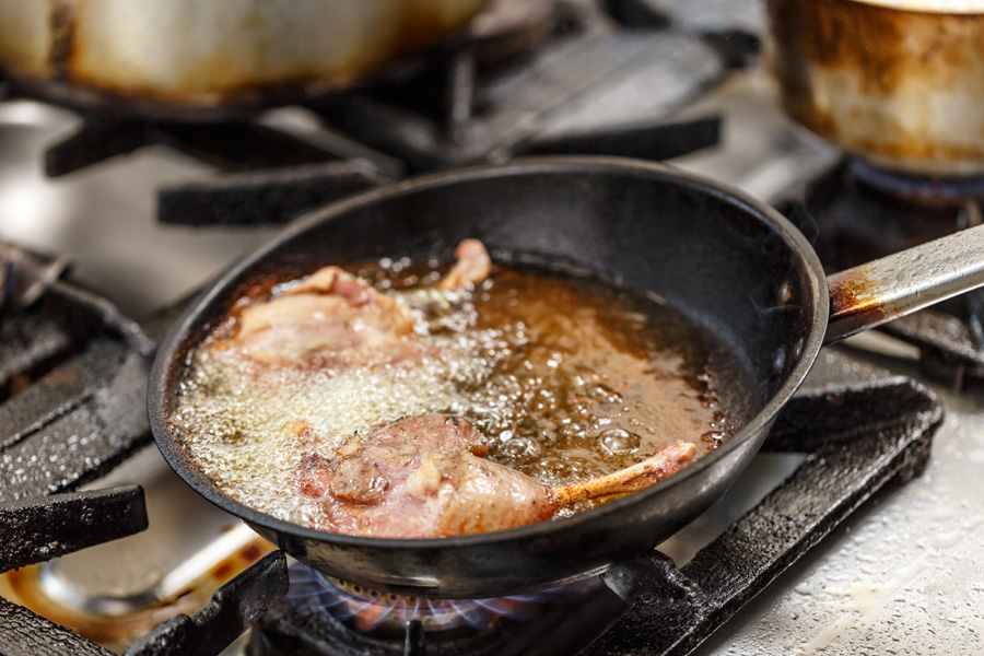 duck legs frying